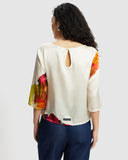 Model wears Silk Smock Top in Diya