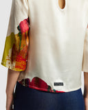 Model wears Silk Smock Top in Diya