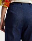 Model wears washed denim wide leg pants