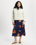 Model wears workwear jacket in a cream bone suede