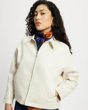 Model wears workwear jacket in a cream bone suede