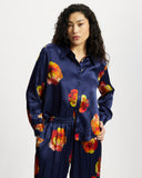 Model wears long sleeve silk shirt in Nour