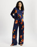 Model wears long sleeve silk shirt in Nour