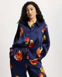 Model wears long sleeve silk shirt in Nour