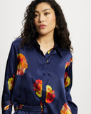 Model wears long sleeve silk shirt in Nour