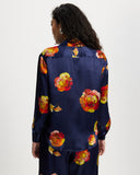 Model wears long sleeve silk shirt in Nour