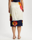 Model wears silk contrast midi skirt in Diya and Nour