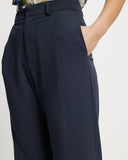 Model wears Suit pants in Navy