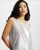 Model wears sleeveless Scoop shell top in sunbeam silver