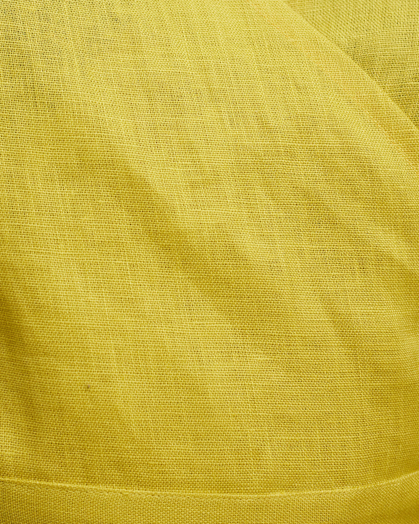 Close up of Model wears Chartreuse Linen Crush Wrap Top Fabric