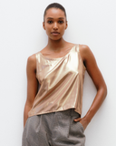 Model wears liquid Gold Scoop Camisole
