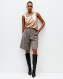 Model wears liquid Gold Scoop Camisole