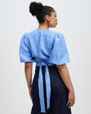 Model wears Periwinkle Crush Linen Wrap Top