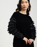 Model wears Starlings Velvet Pullover Dress