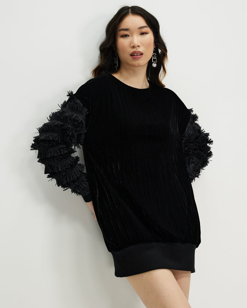 Model wears Starlings Velvet Pullover Dress