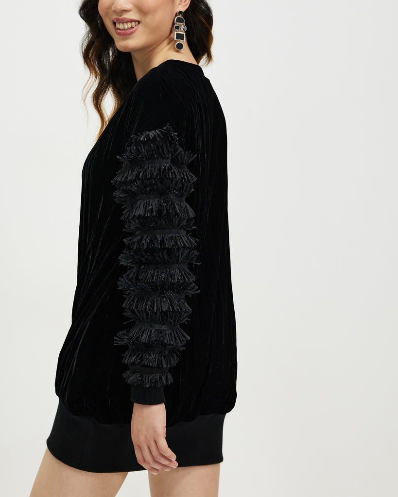 Model wears Starlings Velvet Pullover Dress