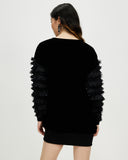 Model wears Starlings Velvet Pullover Dress