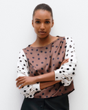 Model wears Bishop Sleeve Top in Timeless Polka