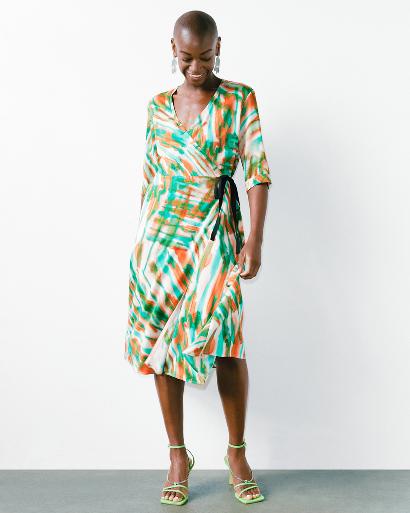 Model wears Tropical Fern Wrap Dress