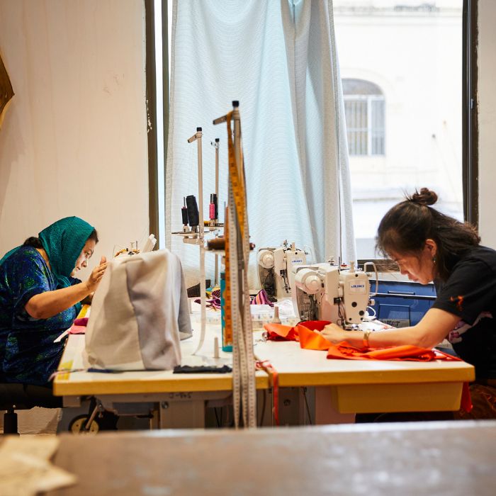 two women sewing at industrial sewing machines