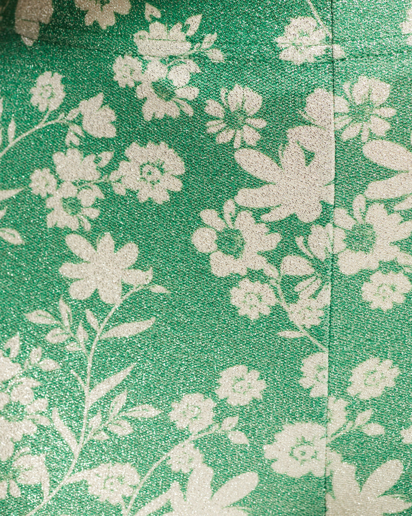 Close up of green floral pattern shimmer fabric