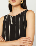 Model wears Black and cream Shell Top