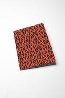 notebook featuring our sejal's curls print against a white backdrop