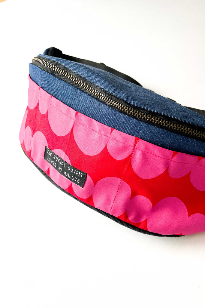 friendship beads funky bum bag with blue denim contrast fabric against white backdrop