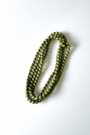 salvia green silk long strand necklace by tabitha cambodia against white backdrop