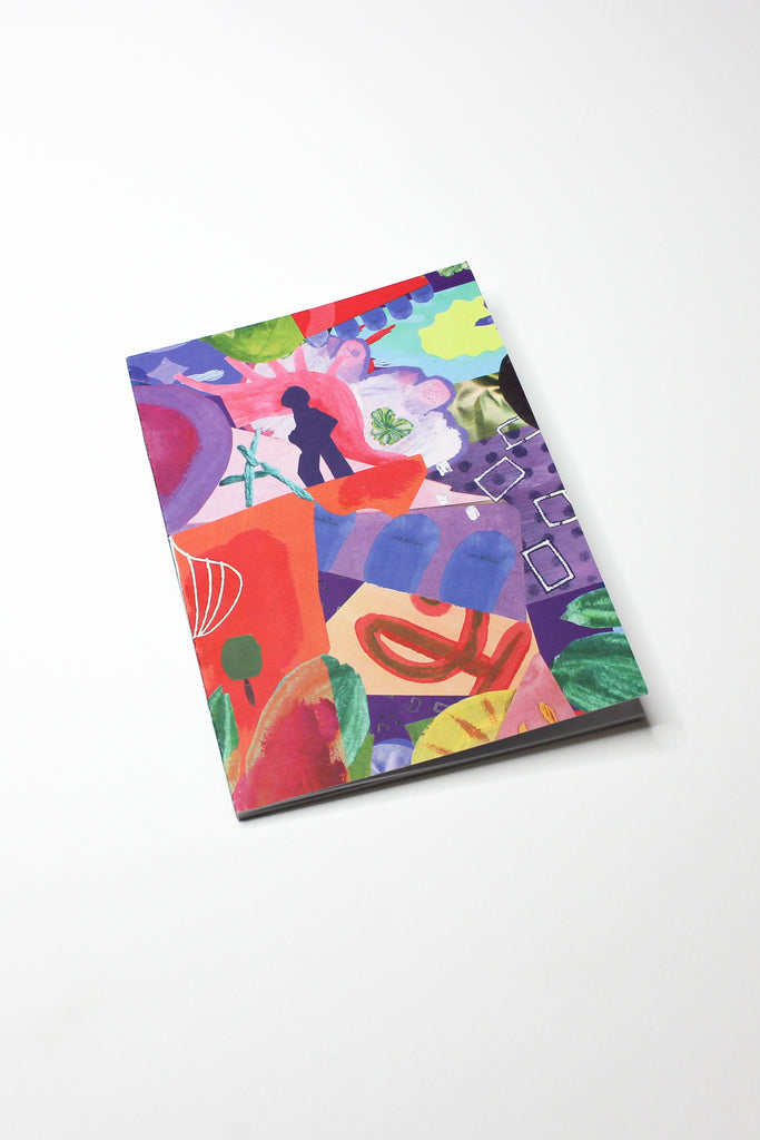 multi-coloured printed notebook sitting on white background