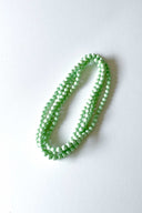 sweet green mint silk long strand necklace by tabitha cambodia against white backdrop