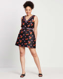 woman wears violet night elastic belt with delicate bloom v-neck black dress