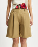 Model wears Bermuda Shorts in tan 