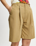 Model wears Bermuda Shorts in tan 