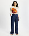 Model wears washed denim wide leg pants