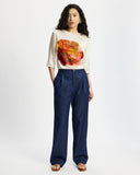 Model wears washed denim wide leg pants
