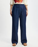 Model wears washed denim wide leg pants
