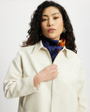Model wears workwear jacket in a cream bone suede 