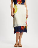 Model wears silk contrast midi skirt in Diya and Nour