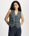 Model wears a Navy, green and blue checked button down Waistcoat 