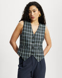 Model wears a Navy, green and blue checked button down Waistcoat 