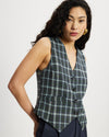 Model wears a Navy, green and blue checked button down Waistcoat 