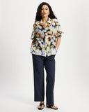 Model wears Relaxed shirt in a colourful watercolour semi sheer print.