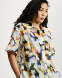 Model wears Relaxed shirt in a colourful watercolour semi sheer print.