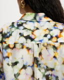 Model wears Relaxed shirt in a colourful watercolour semi sheer print.
