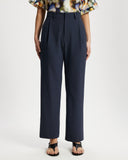 Model wears Suit pants in Navy