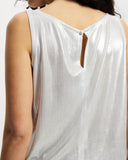 Model wears sleeveless Scoop shell top in sunbeam silver with keyhole button closure