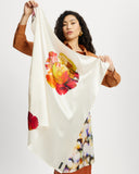 Model holds Silk square Scarf in Diya