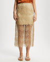 Gold lace skirt worn by a model on a white background