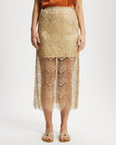 Gold lace skirt worn by a model on a white background
